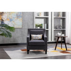 Sillón tapizado en lino con tachuelas y patas de madera maciza