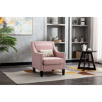 Sillón tapizado en lino con tachuelas y patas de madera maciza