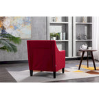 Sillón tapizado en lino con tachuelas y patas de madera maciza