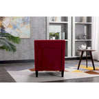 Sillón tapizado en lino con tachuelas y patas de madera maciza
