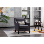 Sillón tapizado en lino con tachuelas y patas de madera maciza