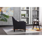 Sillón tapizado en lino con tachuelas y patas de madera maciza